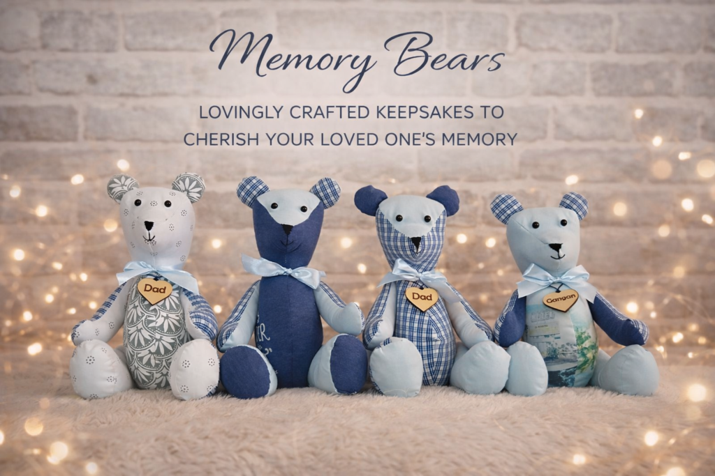 Group of memory bear keepsakes created from sentimental clothing, featuring a range of fabric designs with a wooden heart tag engraved “Dad”.