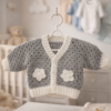 grey-and-white-hand-crocheted-baby-cardigan-nursery-setting.jpg