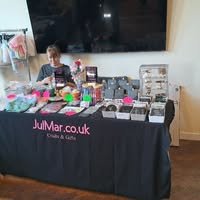 Julie Bryant setting up a craft stall to sell our beautiful Julmar arts and crafts pieces.